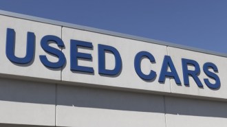 A sign at a used car dealership