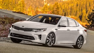 White 2018 Kia Optima near forest