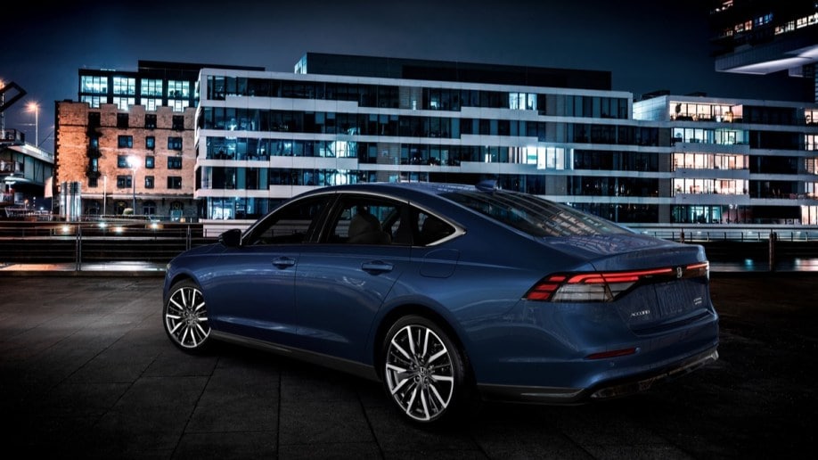 The 2023 Honda Accord in blue, seen from a rear quarter angle