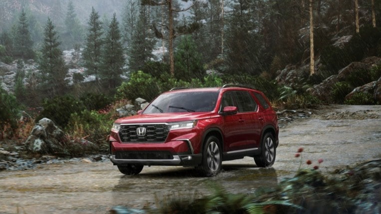 The 2023 Honda Pilot Elite from a front quarter angle