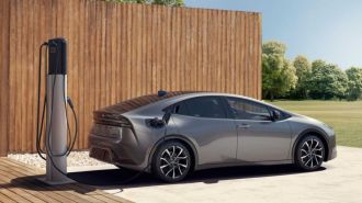 The redesigned 2023 Toyota Prius Prime plug-in hybrid as seen from the rear.