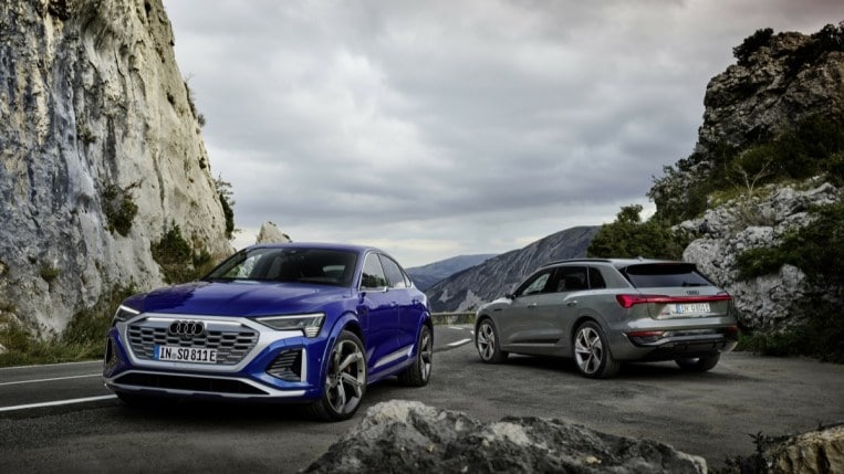 The 2023 Audi Q8 e-tron (facing away from the camera) and Q8 e-tron Sportback (facing the camera).
