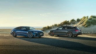 The 2024 Audi RS6 Avant and RS7 Performance models in profile, parked facing each other