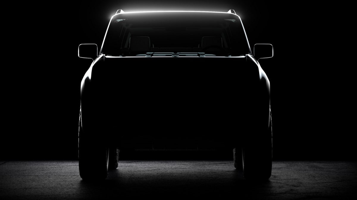 A teaser shot shows a head-on view of the first Scout EV prototype