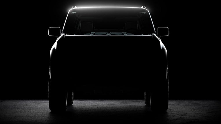 A teaser shot shows a head-on view of the first Scout EV prototype