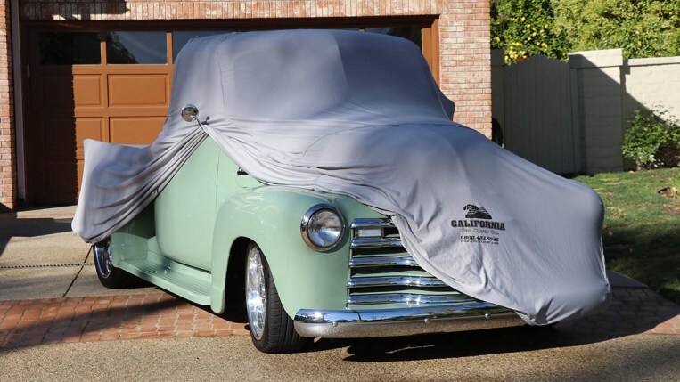 Custom car cover on a classic pickup truck