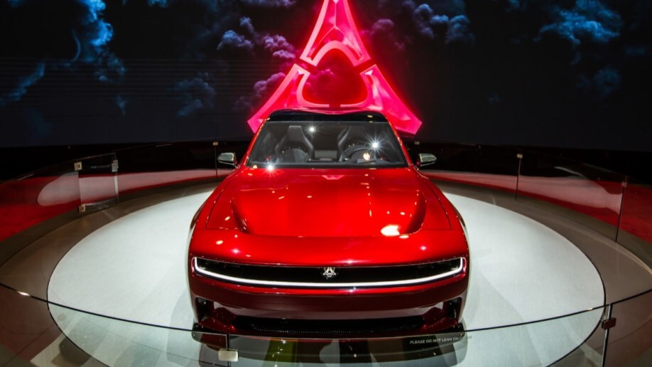 The Dodge Charger Daytona EV concept seen from head on, in red.