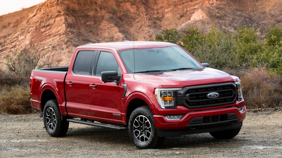 Red 2021 Ford F-150 Hybrid near hill