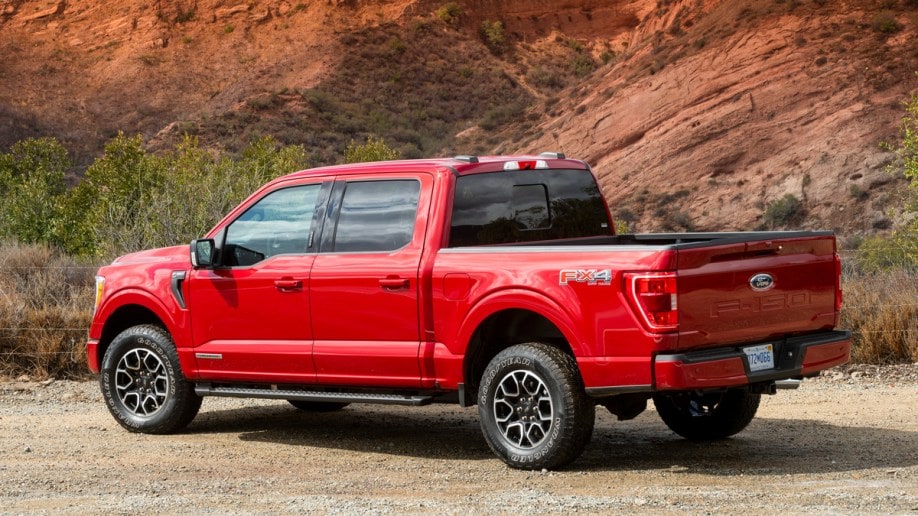 Red 2021 Ford F-150 Hybrid near hill