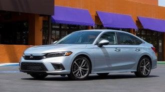Silver 2022 Honda Civic Sedan near purple awnings