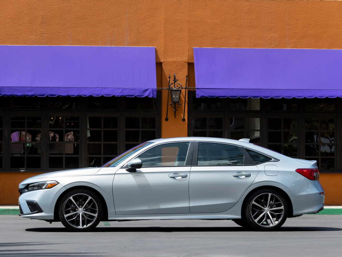 Silver 2022 Honda Civic Sedan near purple awnings