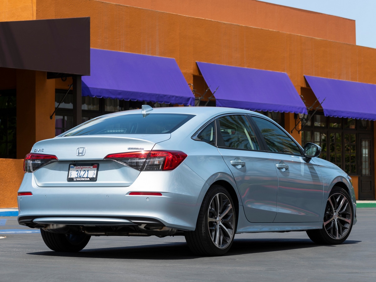 Silver 2022 Honda Civic Sedan near purple awnings
