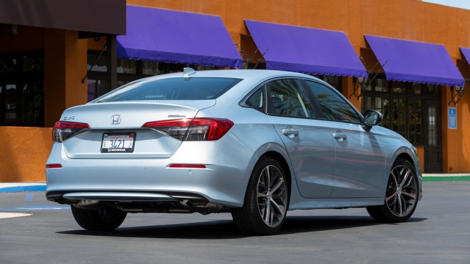 Silver 2022 Honda Civic Sedan near purple awnings