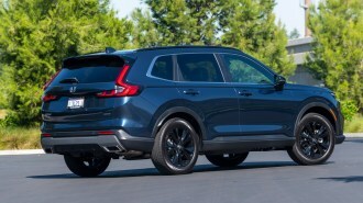 2023 Honda CR-V Hybrid near trees.