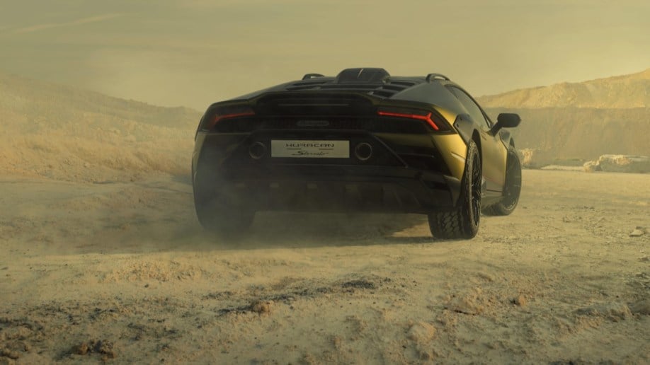 The Lamborghini Huracán Sterrato seen from a rear quarter angle in off-road testing