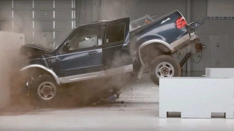 The Insurance Institute for Highway Safety performs a crash test on a Ford F-150 loaded with added weight to evaluate whether its own equipment can test heavier electric cars