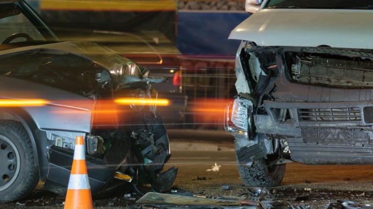 A closeup of the front ends of two vehicles after a crash