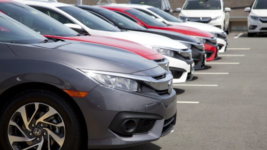 A row of used Honda Accords for sale at a dealership