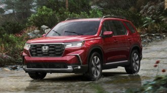 2023 Honda Pilot Elite driving in the rain.