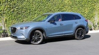 2023 Mazda CX-9 parked near green wall.