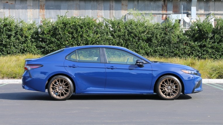 2023 Toyota Camry Hybrid Nightshade right profile view.