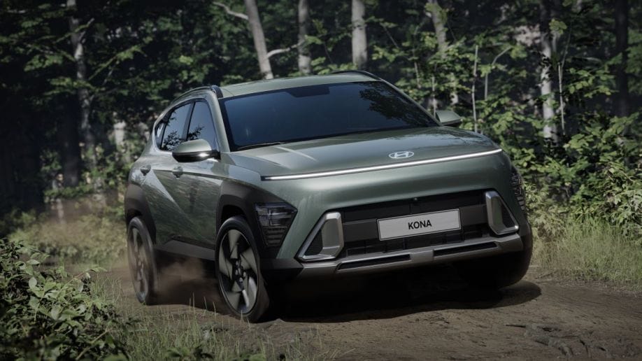 2024 Hyundai Kona driving down a dirt road seen from the front.