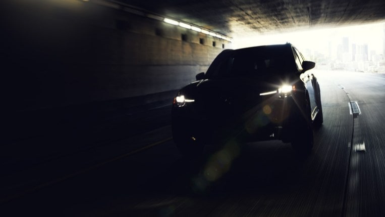 A teaser photo Mazda released showing the upcoming 2024 CX-90 SUV in a dark tunnel