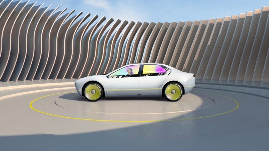 The BMW i Vision Dee concept displaying a driving avator on its windows