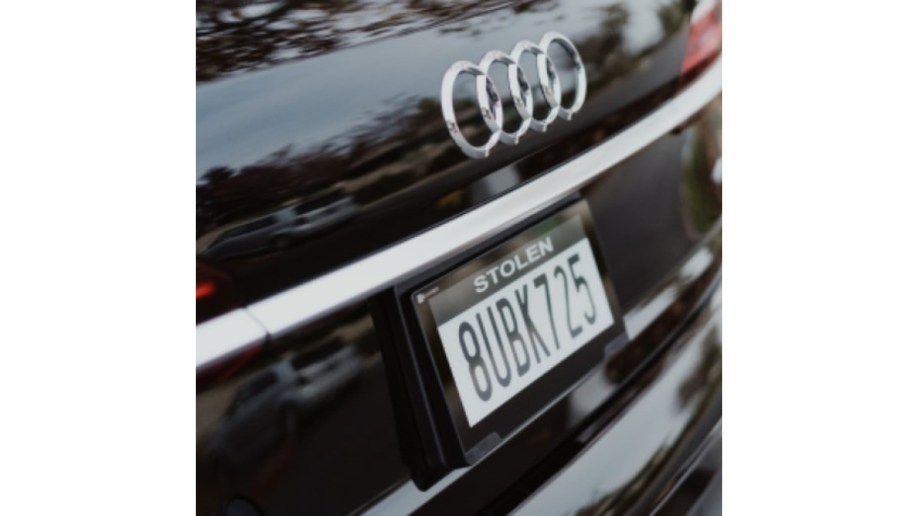 A Reviver digital license plate displaying a "stolen" message