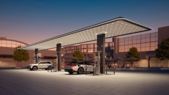 Two Mercedes electric vehicles charge at a charging station