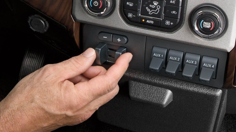 A person adjusting trailer brake controller