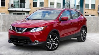 2018 Nissan Rogue Sport parked near apartments.