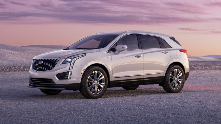 2023 Cadillac XT5 Premium Luxury at sunset with sandy hills in the background.