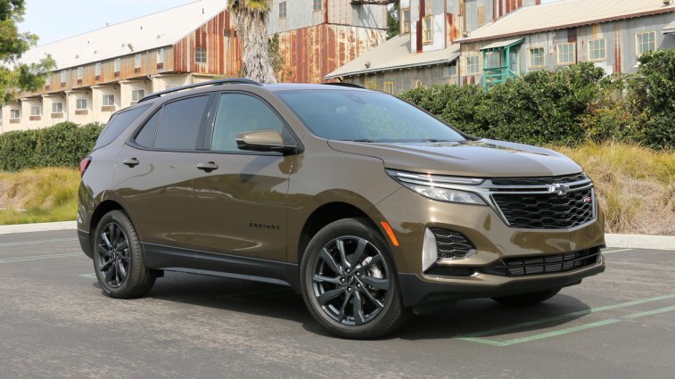 2023 Chevrolet Equinox RS near metal building.
