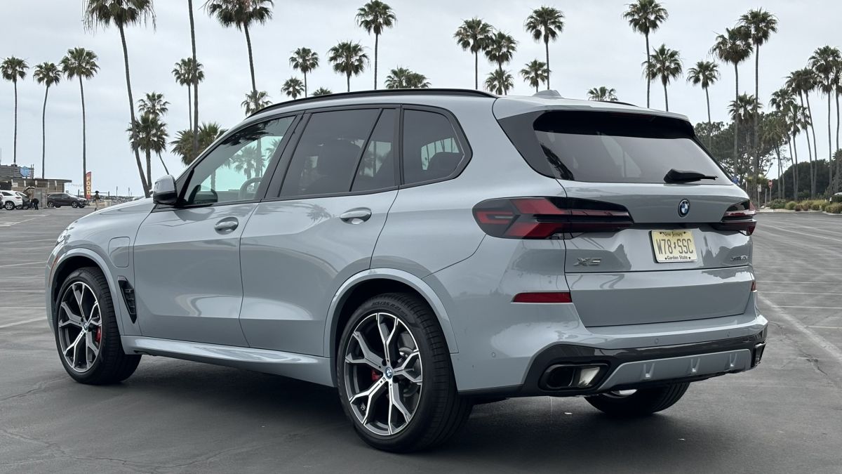 Rear view of the 2024 BMW X5 xDrive50e plug-in hybrid in gray