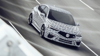 The 2024 Acura Integra Type S as a pace car at the Rolex 24 Hours of Daytona, seen from a front quarter angle