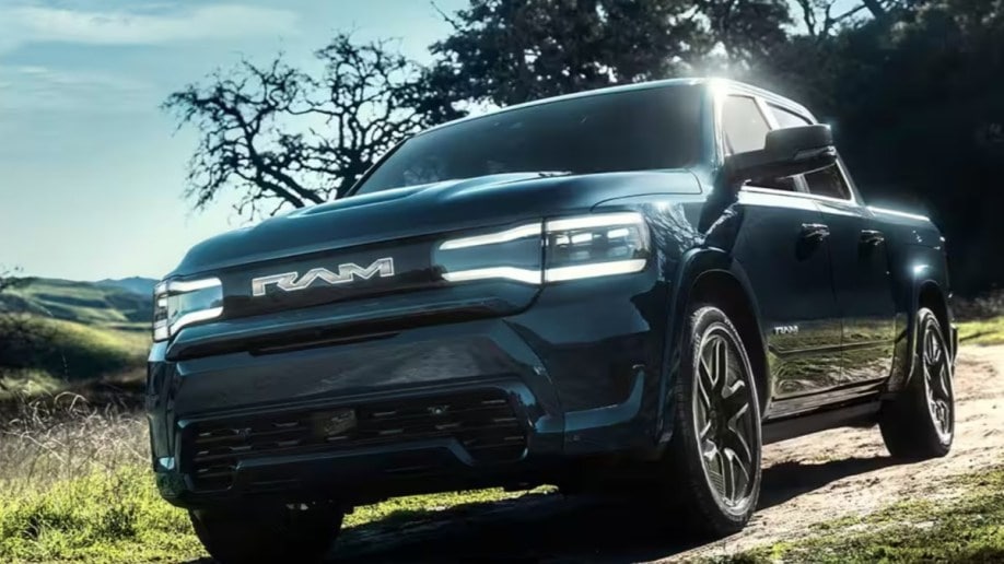 The 2025 Ram 1500 REV seen from a low front angle