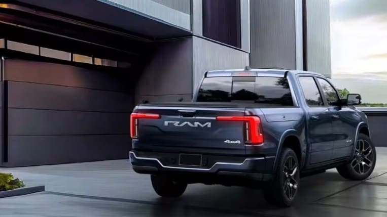 The 2025 Ram 1500 REV seen from a rear quarter angle