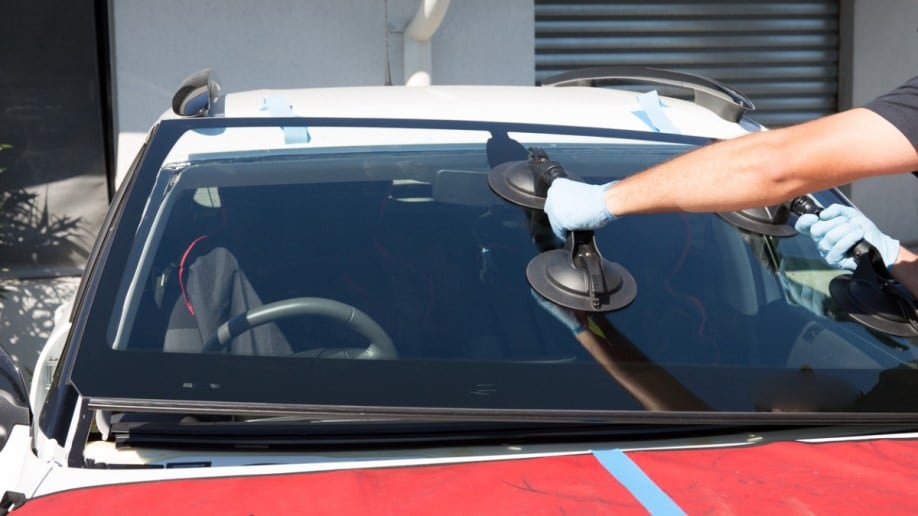 A technician installing a car windshield