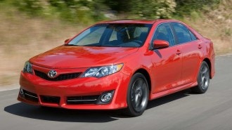 2012 Toyota Camry in red.