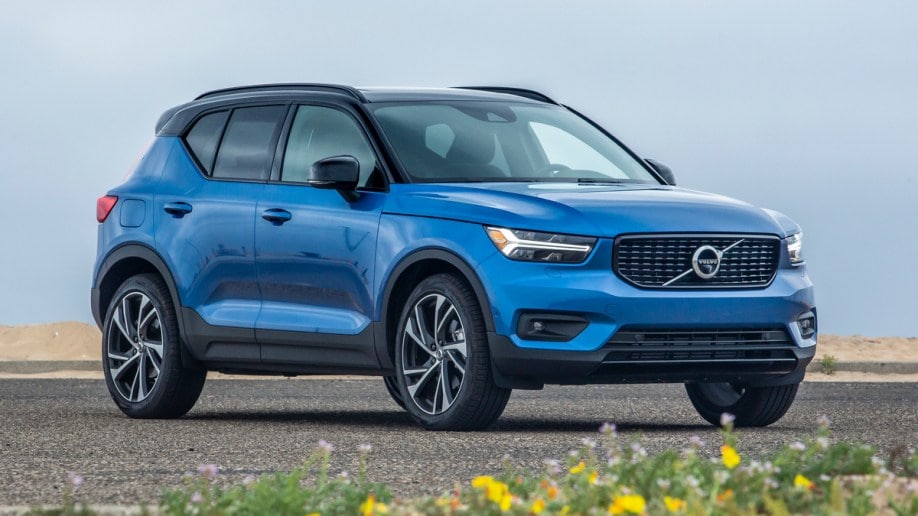 Blue 2019 Volvo XC40 parked near beach.