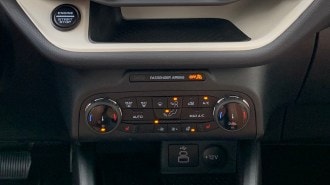 2023 Ford Bronco Sport Heritage Edition climate controls and storage cubby.