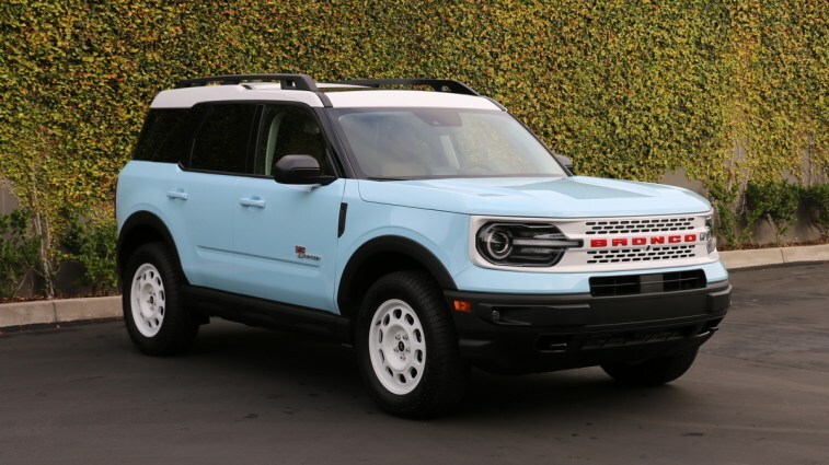 Blue 2023 Ford Bronco Sport Heritage Edition near green wall.
