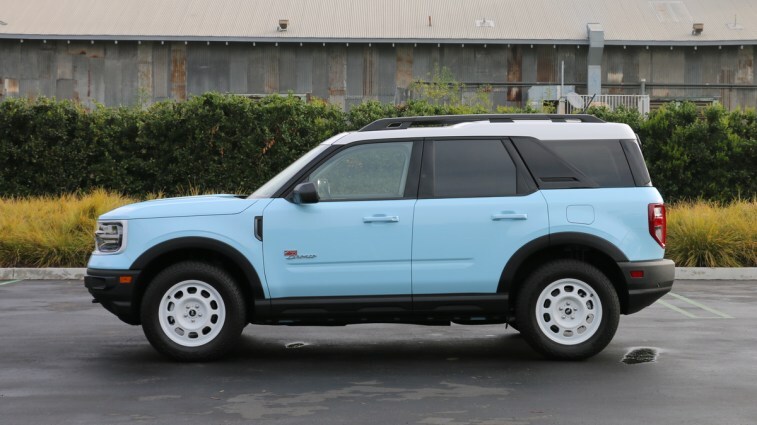 Blue 2023 Ford Bronco Sport Heritage Edition profile view near metal barn.