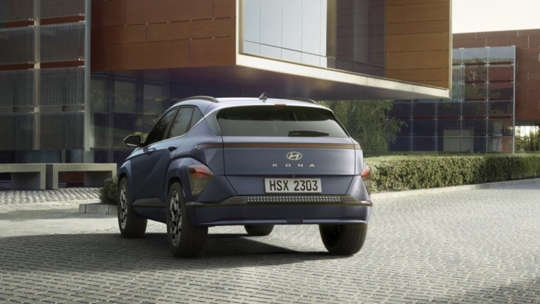 The 2024 Hyundai Kona Electric seen from a rear angle