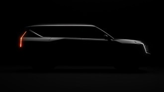 A teaser photo showing the upcoming 2024 Kia EV9 in profile