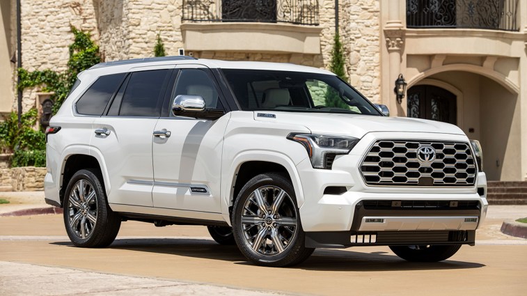 2024 Toyota Sequoia in white, parked near a building.