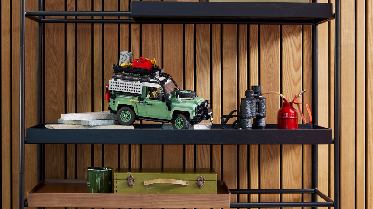 Classic Land Rover Defender 90 Lego set on a middle shelf.