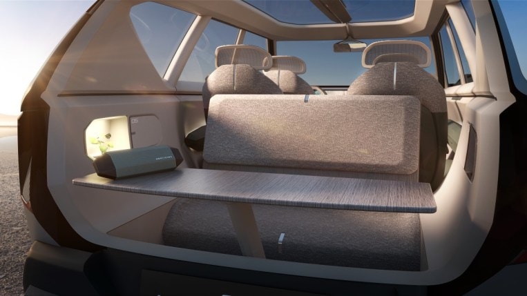 The Kia EV5 concept with its tailgate open and table raised