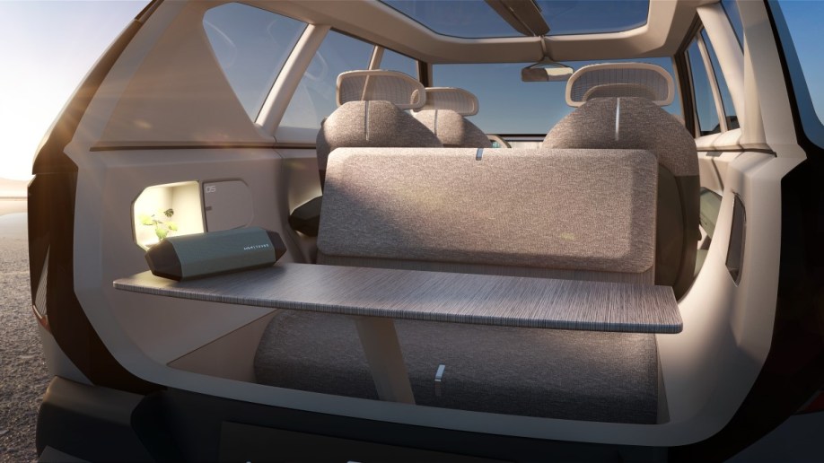 The Kia EV5 concept with its tailgate open and table raised